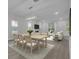 Open-concept living space featuring dining area, living room, fireplace, and lots of natural light at 3029 Robeson Trce, Johns Island, SC 29455