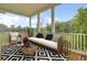 Stylish outdoor porch area with comfortable seating and scenic views at 3029 Robeson Trce, Johns Island, SC 29455