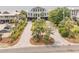 Aerial shot of a stunning beach house, showcasing the driveway, lush landscaping, and prime location at 3126-B Palmetto Blvd # 4, Edisto Island, SC 29438