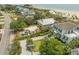 Aerial view of a coastal home with a spacious yard and convenient parking near the beach at 3126-B Palmetto Blvd # 4, Edisto Island, SC 29438