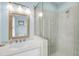 This bathroom has gray tiling and a glass shower at 3126-B Palmetto Blvd # 4, Edisto Island, SC 29438