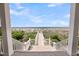 Scenic view of the beach from the home's porch, accessible via a charming walkway at 3126-B Palmetto Blvd # 4, Edisto Island, SC 29438