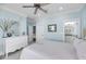 This bedroom has a mirror, white dresser, and white walls at 3126-B Palmetto Blvd # 4, Edisto Island, SC 29438