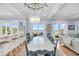 Bright and airy dining area leads to living room, offering ocean views and comfortable seating with bar access at 3126-B Palmetto Blvd # 4, Edisto Island, SC 29438