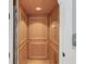 This residential elevator has paneled wood interiors at 3126-B Palmetto Blvd # 4, Edisto Island, SC 29438