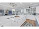 Bright white kitchen featuring modern appliances and nautical-themed decor at 3126-B Palmetto Blvd # 4, Edisto Island, SC 29438
