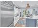 Kitchen area with bar, glass cabinets, sink, drawers, and stainless steel appliances at 3126-B Palmetto Blvd # 4, Edisto Island, SC 29438