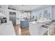 Spacious kitchen with stainless steel appliances, a large island, bar seating, and lots of natural light at 3126-B Palmetto Blvd # 4, Edisto Island, SC 29438