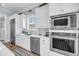 Bright kitchen with stainless steel appliances and white cabinetry, with natural light from window at 3126-B Palmetto Blvd # 4, Edisto Island, SC 29438