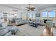 Bright and airy living room with hardwood floors, a view of the ocean, and an open layout at 3126-B Palmetto Blvd # 4, Edisto Island, SC 29438