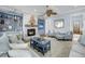 Inviting living room with built-in shelves, a brick fireplace, and comfortable seating for relaxation at 3126-B Palmetto Blvd # 4, Edisto Island, SC 29438