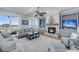 Cozy living room with ocean views, a fireplace, built-in shelves, and comfortable seating at 3126-B Palmetto Blvd # 4, Edisto Island, SC 29438