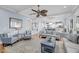 Spacious living room with coffered ceiling, ceiling fan, and open concept into the kitchen at 3126-B Palmetto Blvd # 4, Edisto Island, SC 29438