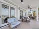 Expansive porch with views of the beach, ample seating, and ceiling fans at 3126-B Palmetto Blvd # 4, Edisto Island, SC 29438