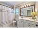 Cozy bathroom featuring a large mirror, a shower with curtain, and a toilet at 3152 Riverine, Charleston, SC 29414