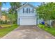 Two-story home with a spacious driveway and manicured front lawn at 3152 Riverine, Charleston, SC 29414