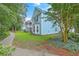 Well-maintained two-story home with mature trees and a neatly landscaped yard at 3152 Riverine, Charleston, SC 29414