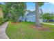 Attractive two-story home with a beautifully landscaped yard and mature trees at 3152 Riverine, Charleston, SC 29414