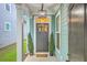 Cozy front porch with decorative plants and stylish lighting fixture at 3152 Riverine, Charleston, SC 29414