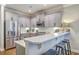 Kitchen featuring stainless steel appliances, light gray cabinets, marble countertops and breakfast bar at 3152 Riverine, Charleston, SC 29414