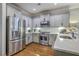 Updated kitchen featuring stainless steel appliances, light gray cabinets and marble countertops at 3152 Riverine, Charleston, SC 29414