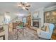 Spacious living room with fireplace, hardwood floors, and ample seating at 3152 Riverine, Charleston, SC 29414