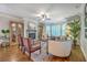 Cozy living room featuring a stone fireplace, hardwood floors, and natural light at 3152 Riverine, Charleston, SC 29414