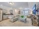Cozy living space with kitchenette, sofa, and mounted television for comfortable living at 3152 Riverine, Charleston, SC 29414