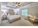 Bright main bedroom suite featuring tray ceiling, large windows, and neutral decor at 3152 Riverine, Charleston, SC 29414