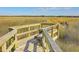 Scenic view of a marsh from a wooden viewing platform with bench seating at 3152 Riverine, Charleston, SC 29414