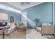 Comfortable patio area with light blue walls, modern wicker furniture, and stylish decorations at 3152 Riverine, Charleston, SC 29414