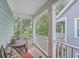 Covered porch with seating area, perfect for enjoying the outdoors at 3152 Riverine, Charleston, SC 29414