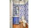 Stylish powder room with unique wallpaper and modern fixtures at 3152 Riverine, Charleston, SC 29414