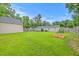 The spacious backyard is completely fenced-in and features lush green grass at 337 Price St, Goose Creek, SC 29445