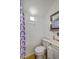 The bathroom is small with a shower, toilet, sink and mirror. It is well lit at 337 Price St, Goose Creek, SC 29445