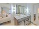 Bathroom featuring double sinks with marble countertops and modern fixtures at 337 Price St, Goose Creek, SC 29445