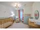 Well-lit Bedroom featuring a crib and decor at 337 Price St, Goose Creek, SC 29445