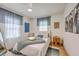Inviting bedroom featuring a bed with a throw blanket and modern decor at 337 Price St, Goose Creek, SC 29445