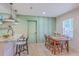 Charming dining area with a wooden table, and view to the kitchen with granite countertops at 337 Price St, Goose Creek, SC 29445