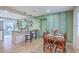 Inviting dining area featuring a wooden table, chairs, and a view of the kitchen at 337 Price St, Goose Creek, SC 29445