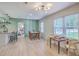 Bright dining area with hardwood floors, stylish lighting, and a charming chess table at 337 Price St, Goose Creek, SC 29445