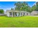 Charming single-story home with a well-manicured lawn, a covered porch, and neutral siding at 337 Price St, Goose Creek, SC 29445