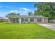 Charming single-story home with a well-manicured lawn, a covered porch, and neutral siding at 337 Price St, Goose Creek, SC 29445