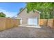 The detached garage has a white garage door and a small entry door. Has ADT security at 337 Price St, Goose Creek, SC 29445