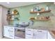 Stylish kitchen featuring granite countertops, stainless steel appliances, and decorative shelving at 337 Price St, Goose Creek, SC 29445