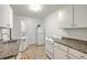 The kitchen features white appliances, white cabinets, and a light brown countertop at 337 Price St, Goose Creek, SC 29445