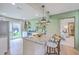 Modern kitchen with granite countertops, stainless steel appliances, and a view of the backyard at 337 Price St, Goose Creek, SC 29445