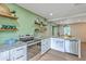 Kitchen showcasing stainless steel appliances, granite countertops, and white cabinetry at 337 Price St, Goose Creek, SC 29445