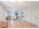 Open-concept living space with light wood floors and seamless flow to the dining area at 337 Price St, Goose Creek, SC 29445