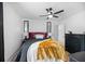 Well-lit bedroom with modern decor, ceiling fan, dark accents, and large window at 3506 Galaxy Rd, Ladson, SC 29456